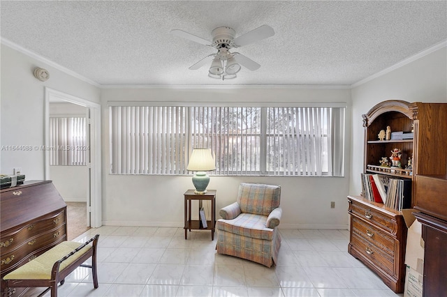 sitting room with light tile patterned floors, crown molding, ceiling fan, and a textured ceiling