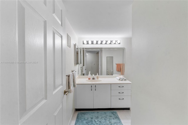 bathroom featuring tile patterned floors and vanity