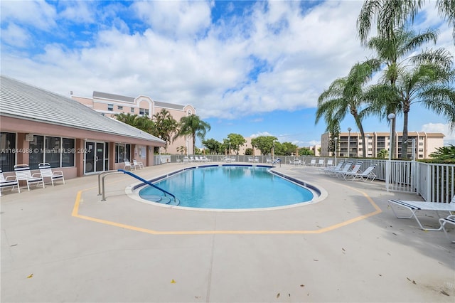 view of swimming pool with a patio area