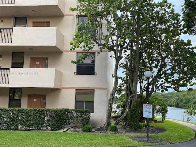 view of building exterior featuring a water view