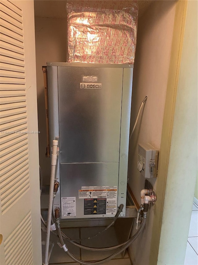 utility room with heating unit