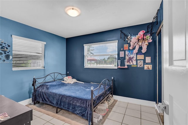 bedroom with light tile patterned floors