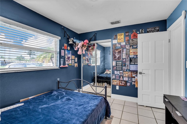 bedroom featuring light tile patterned floors