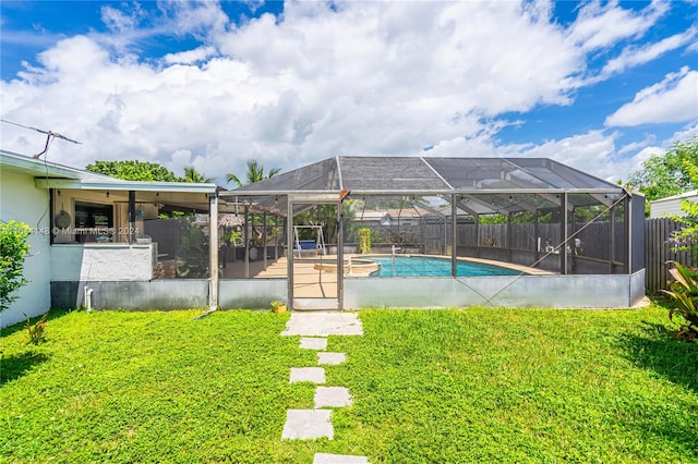 view of swimming pool with glass enclosure and a yard