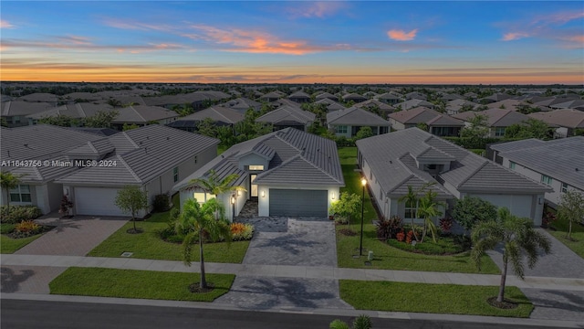 birds eye view of property with a residential view