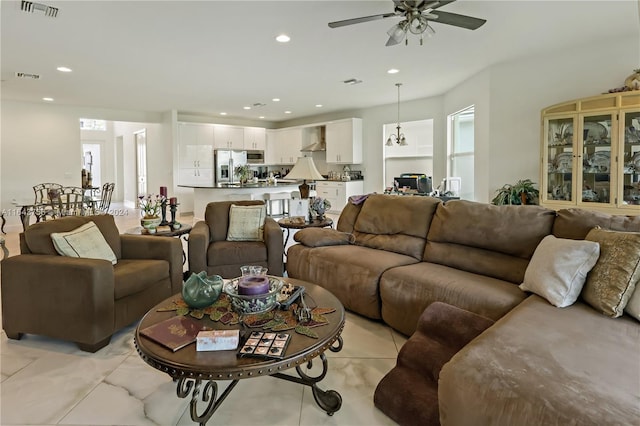 living area featuring recessed lighting, visible vents, and ceiling fan