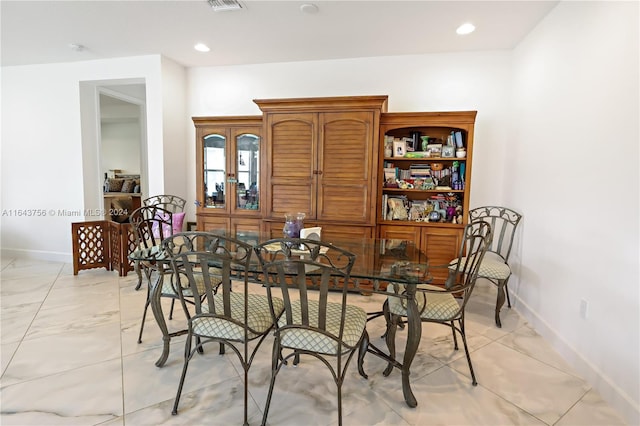 dining area with recessed lighting, visible vents, and baseboards