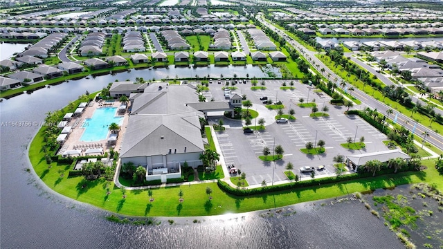 bird's eye view featuring a water view and a residential view