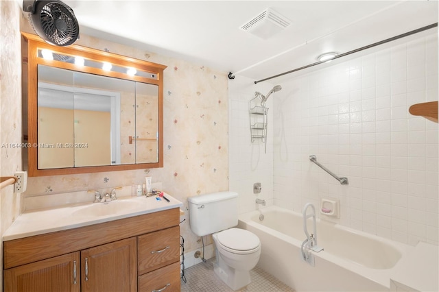 full bathroom with vanity, tile patterned floors, tiled shower / bath combo, and toilet