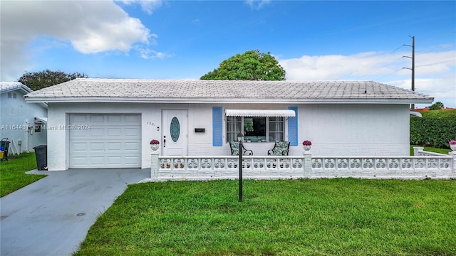 single story home with a garage and a front yard