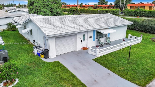 single story home featuring a garage, central AC unit, and a front yard