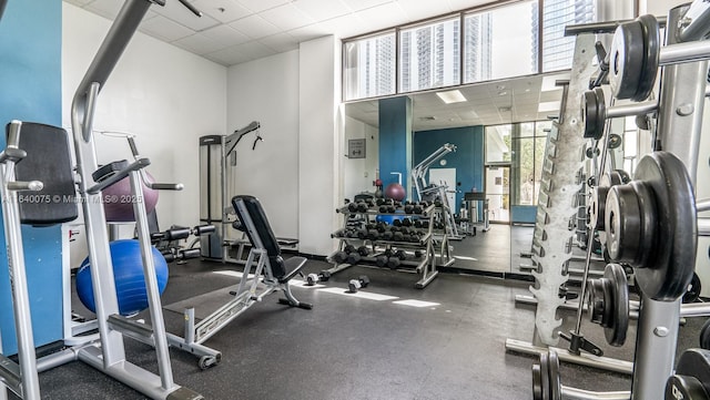 workout area featuring a paneled ceiling