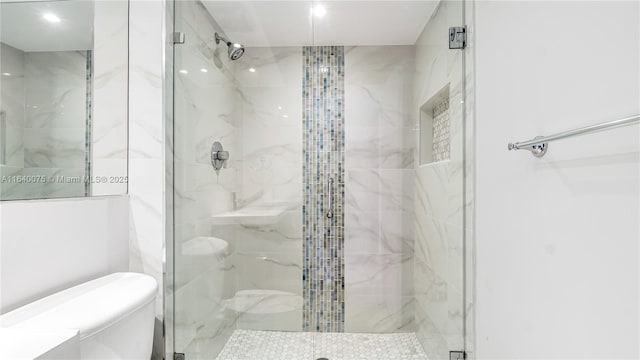 bathroom with an enclosed shower and toilet