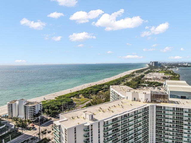 aerial view featuring a water view and a beach view