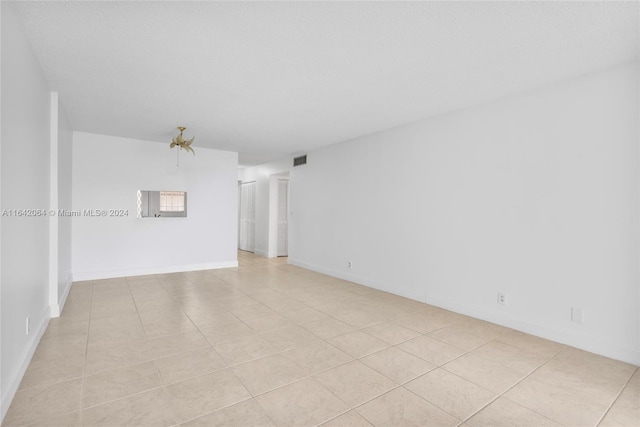 view of tiled spare room