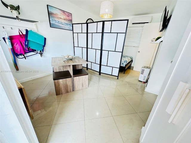 bathroom featuring a wall mounted AC and tile patterned floors