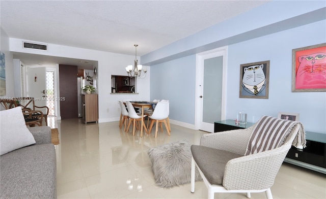 dining space featuring a chandelier and tile patterned flooring