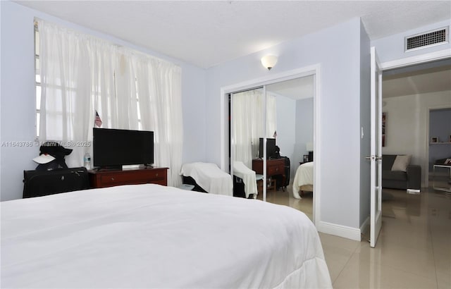 bedroom featuring a closet and a textured ceiling