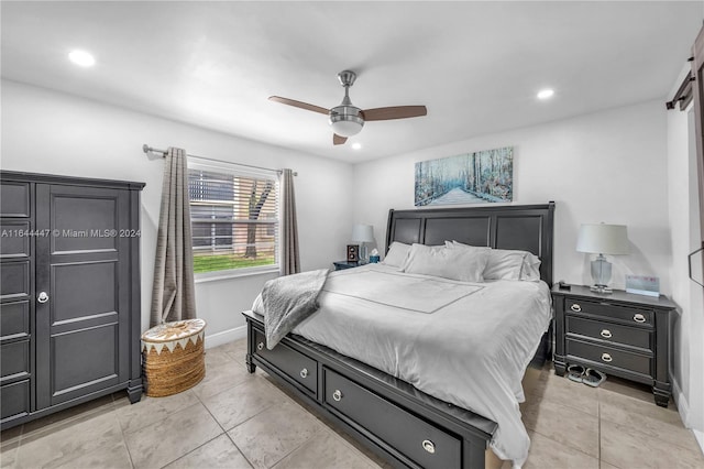 bedroom featuring ceiling fan and light tile patterned floors