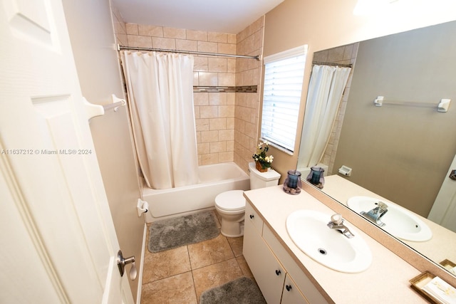 full bathroom featuring tile patterned floors, shower / bath combination with curtain, toilet, and vanity