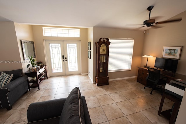 interior space featuring ceiling fan, light tile patterned floors, and french doors