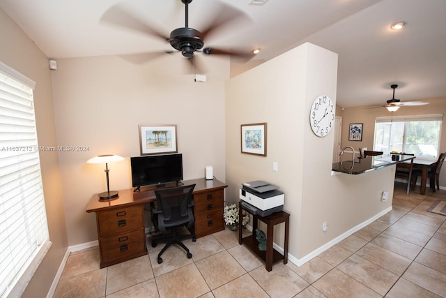 office space with light tile patterned floors and ceiling fan