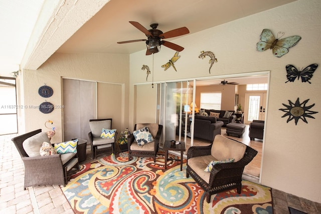 interior space featuring ceiling fan and an outdoor hangout area