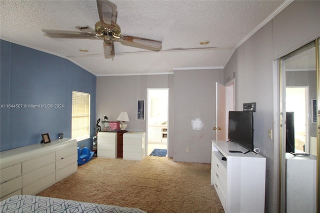 bedroom featuring vaulted ceiling, crown molding, a textured ceiling, ceiling fan, and light carpet