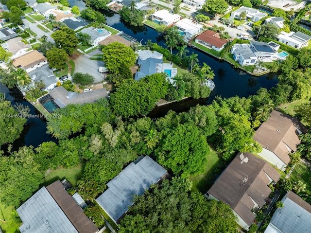 birds eye view of property featuring a water view and a residential view