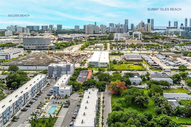 birds eye view of property featuring a city view