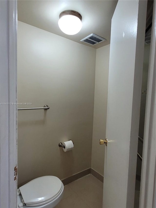 bathroom featuring tile patterned floors and toilet