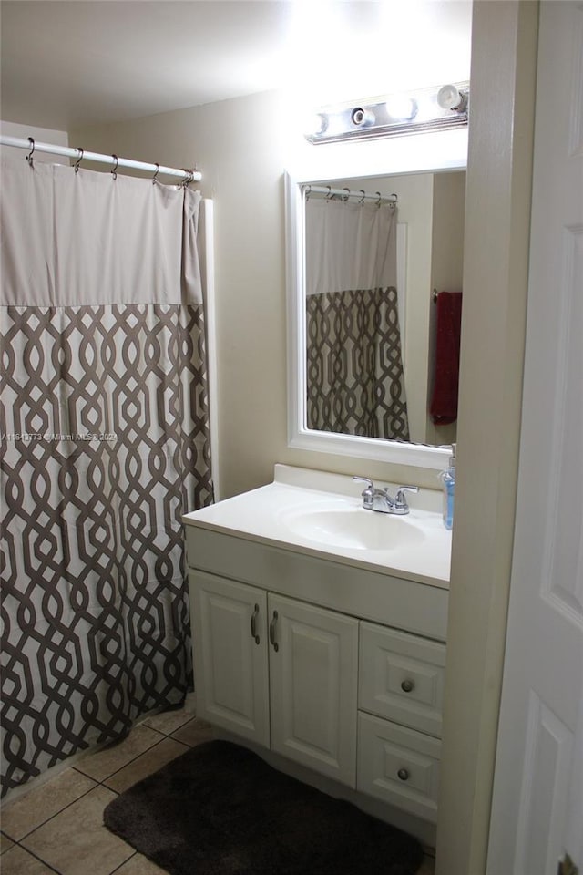 bathroom with vanity, tile patterned floors, and walk in shower