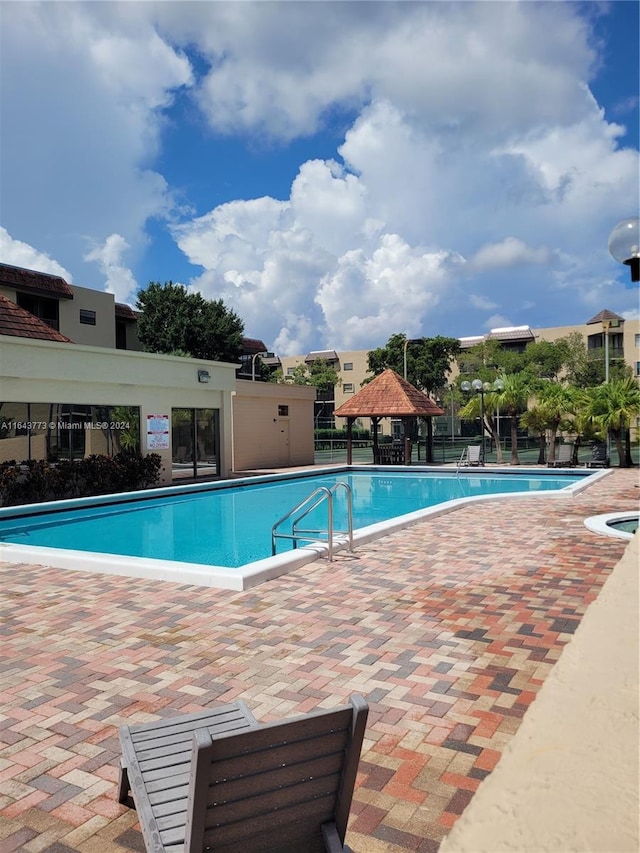 view of swimming pool with a patio area