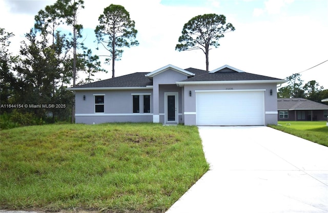 ranch-style house with a front yard and a garage