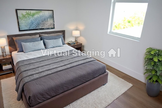 bedroom featuring dark wood-type flooring