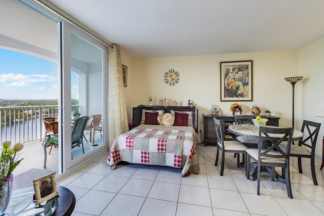 bedroom featuring access to outside and light tile patterned flooring