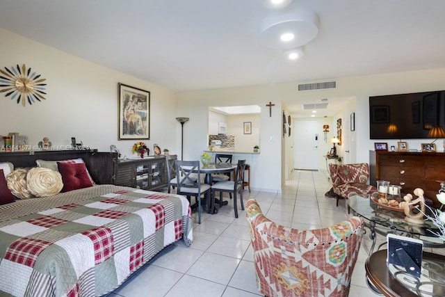 bedroom with light tile patterned floors