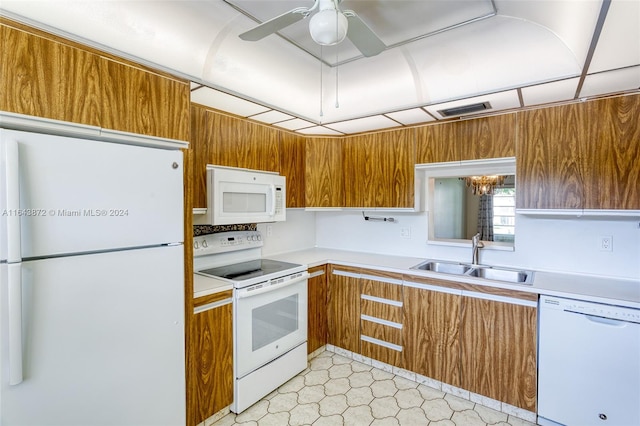 kitchen featuring ceiling fan, white appliances, and sink