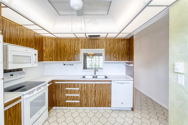 kitchen with sink and white appliances