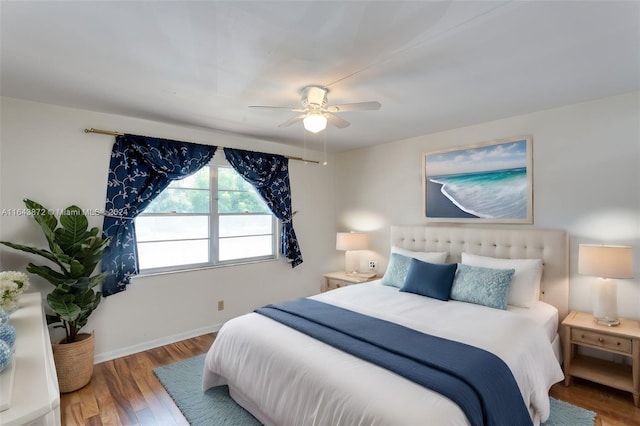 bedroom featuring wood-type flooring and ceiling fan