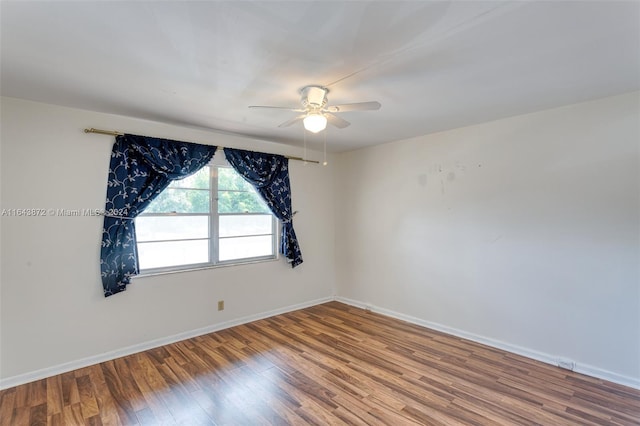 unfurnished room featuring hardwood / wood-style floors and ceiling fan