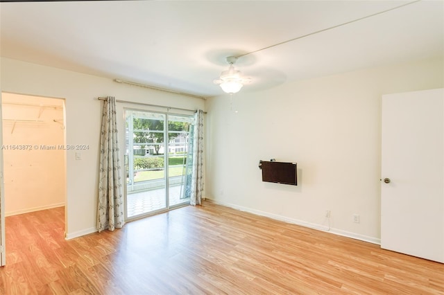 unfurnished room featuring light hardwood / wood-style floors and ceiling fan