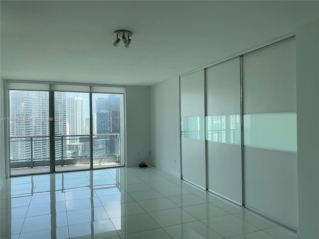 unfurnished bedroom featuring a closet and light tile patterned flooring