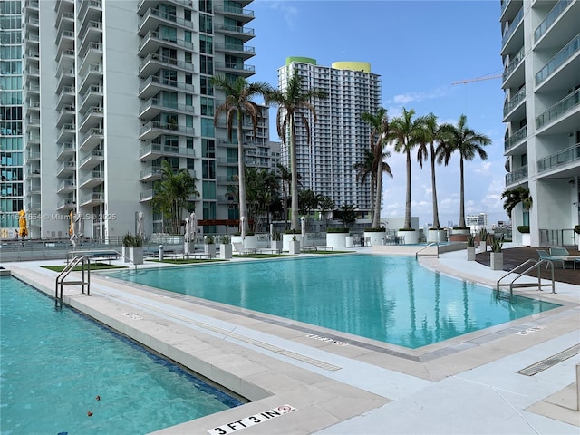 view of swimming pool featuring a patio area