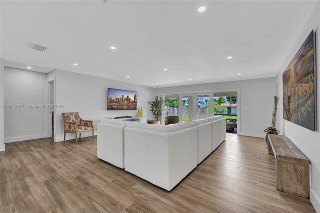 living room with light hardwood / wood-style floors