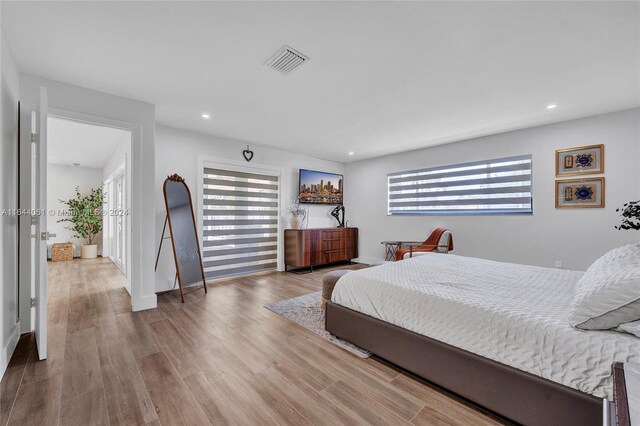 bedroom with wood-type flooring