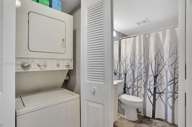 6219 Coral Lake Dr Unit 207, Margate, FL 33063 - laundry area with stacked washing maching and dryer, laundry area, and visible vents