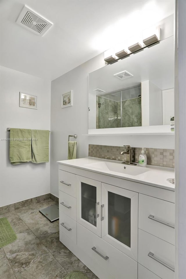 6219 Coral Lake Dr Unit 207, Margate, FL 33063 - bathroom featuring decorative backsplash, visible vents, a stall shower, and vanity