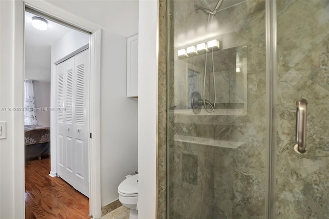 6219 Coral Lake Dr Unit 207, Margate, FL 33063 - full bath featuring toilet, a stall shower, baseboards, and wood finished floors