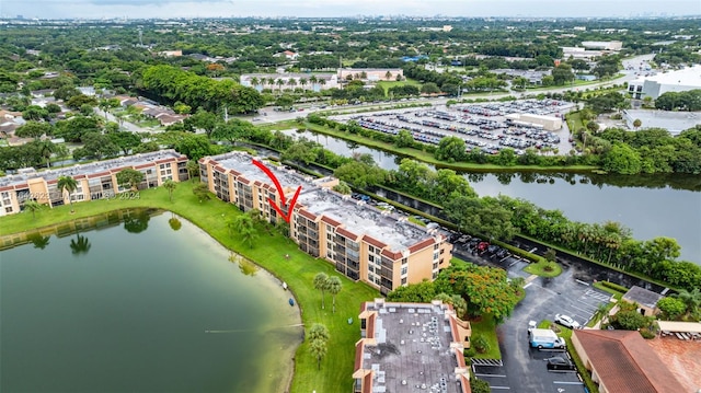 drone / aerial view with a water view